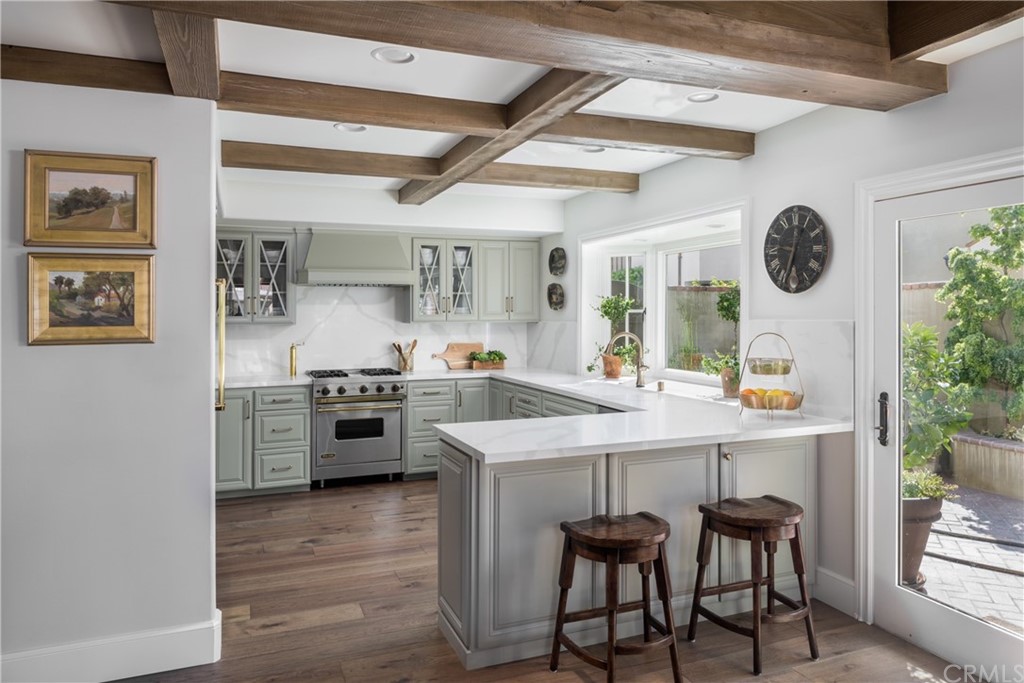 5273 Appian Way Long Beach, CA 90803 - Photo 6 of 34 a kitchen with a sink cabinets and wooden floor
