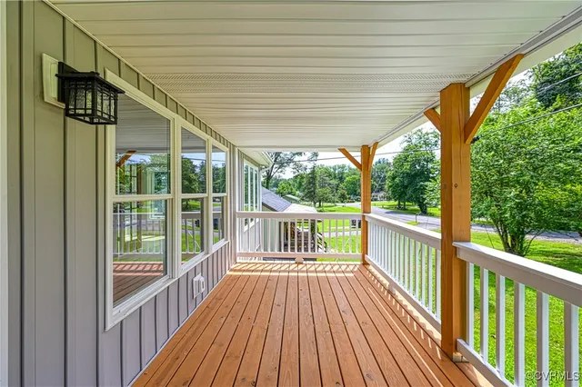 a view of a balcony with wooden floor