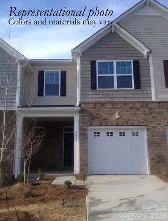 a front view of a house with yard