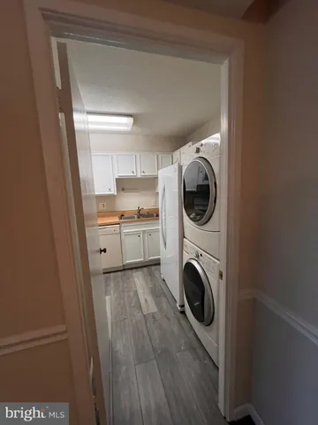 a view of a kitchen with washer and dryer