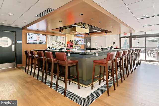 a dining hall with lots of tables a dining table and chairs