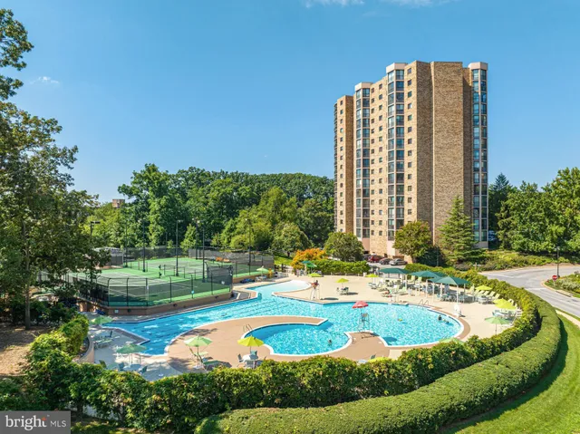 a view of a swimming pool with a lounge chair
