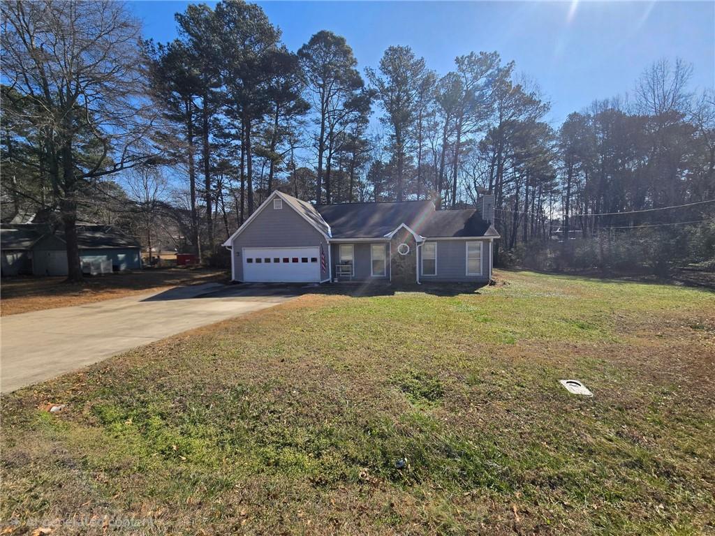 136 Carl-Midway Church Road Auburn, GA 30011 - Photo 2 of 3 a view of a house with a yard