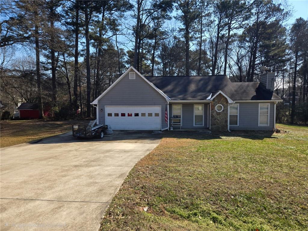 136 Carl-Midway Church Road Auburn, GA 30011 - Photo 3 of 3 a front view of a house with a yard