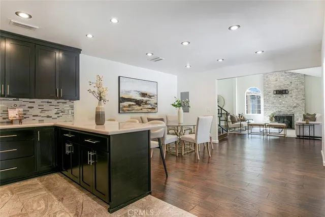 a bathroom with a tub a sink and a mirror
