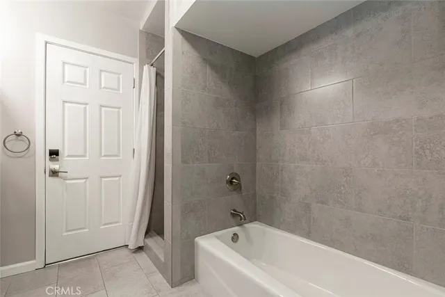 a bathroom with a bathtub and a toilet