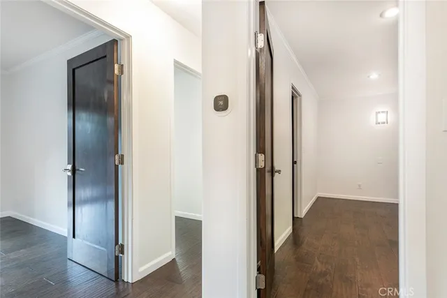 a view of a pathway of a house with wooden fence