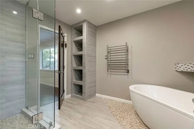 a view of swimming pool on a sunny day with lawn chairs