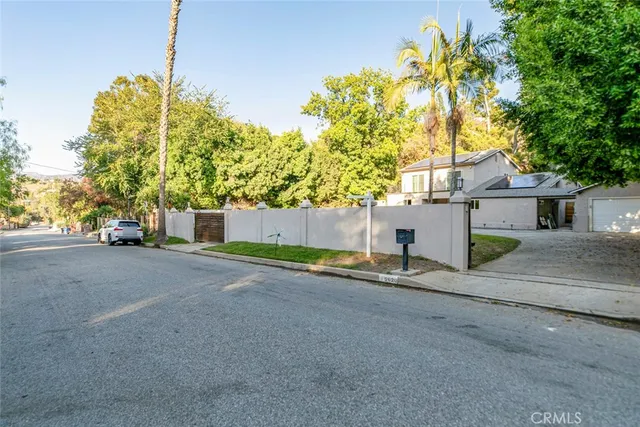 a living room with furniture wooden floor and a fireplace