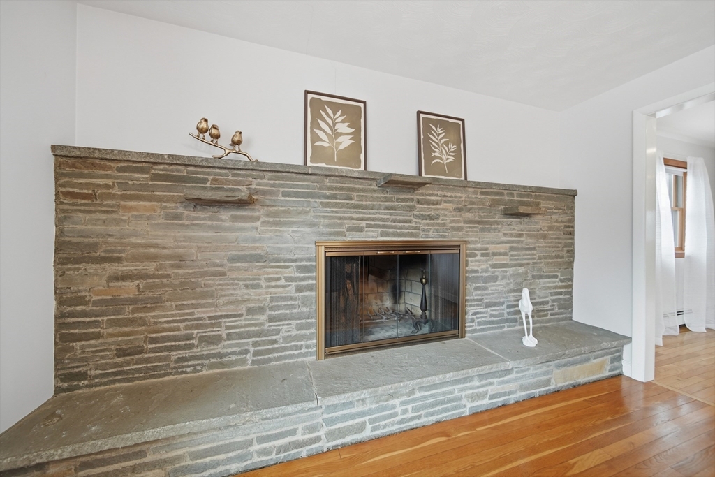 11 Lawrence Street Wakefield, MA 01880 - Photo 14 of 42 a view of fireplace and wooden floor