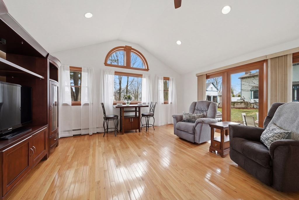 11 Lawrence Street Wakefield, MA 01880 - Photo 15 of 42 a living room with furniture and a flat screen tv