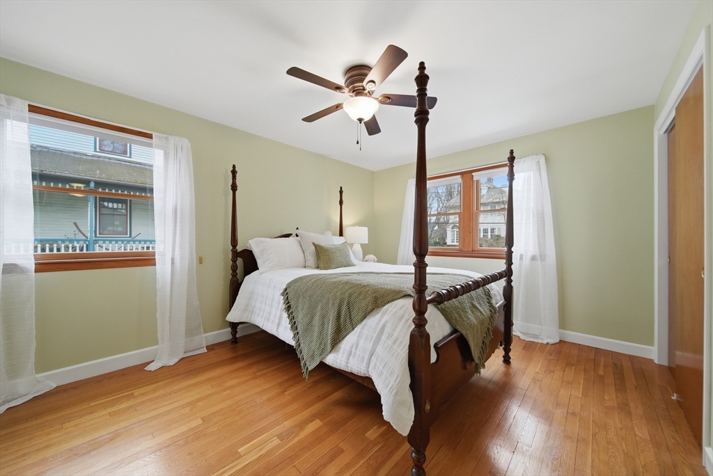 11 Lawrence Street Wakefield, MA 01880 - Photo 20 of 42 a bedroom with a bed and wooden floor