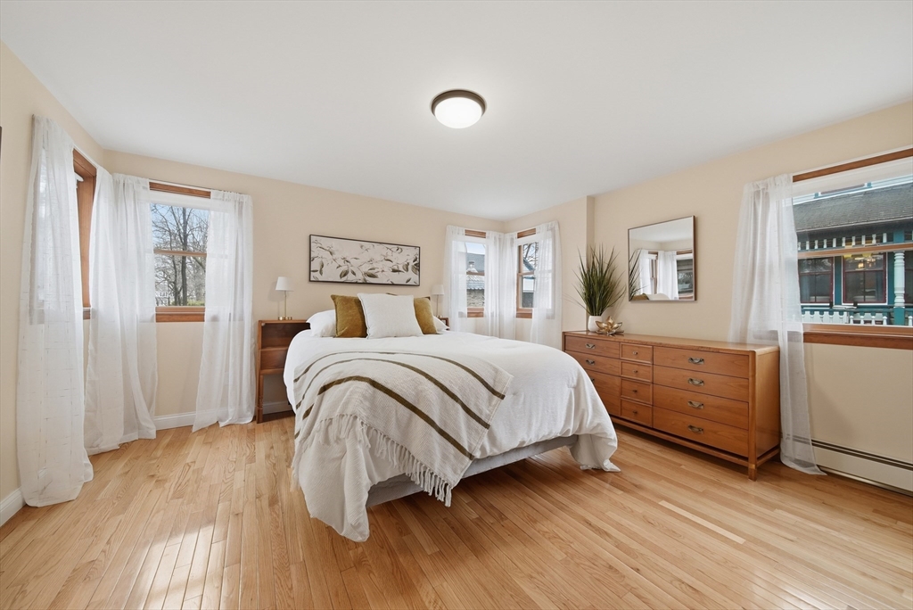 11 Lawrence Street Wakefield, MA 01880 - Photo 22 of 42 a bedroom with a bed and a dresser