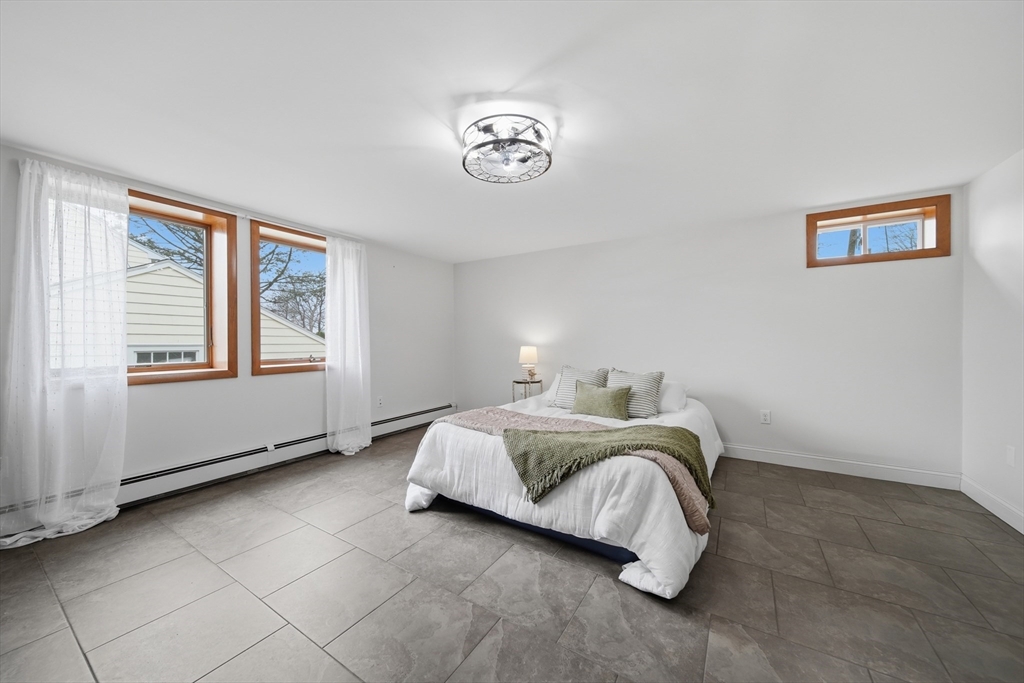 11 Lawrence Street Wakefield, MA 01880 - Photo 24 of 42 a bedroom with a bed and a window