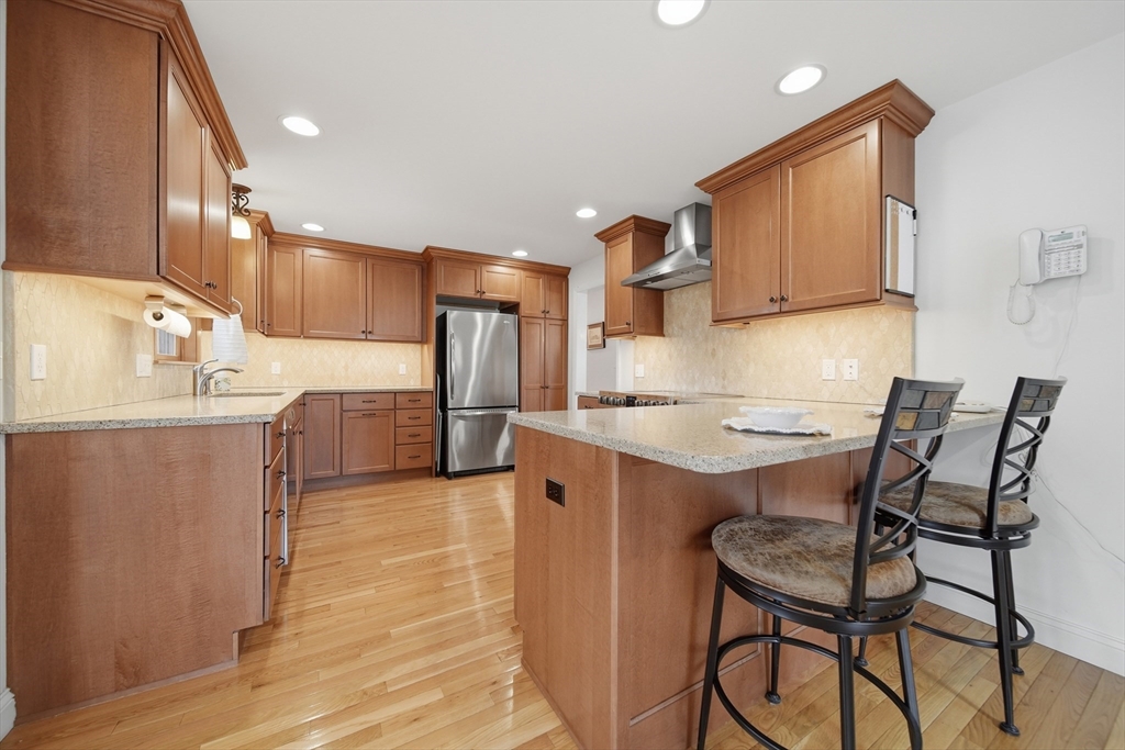 11 Lawrence Street Wakefield, MA 01880 - Photo 6 of 42 a kitchen with a sink cabinets and stainless steel appliances
