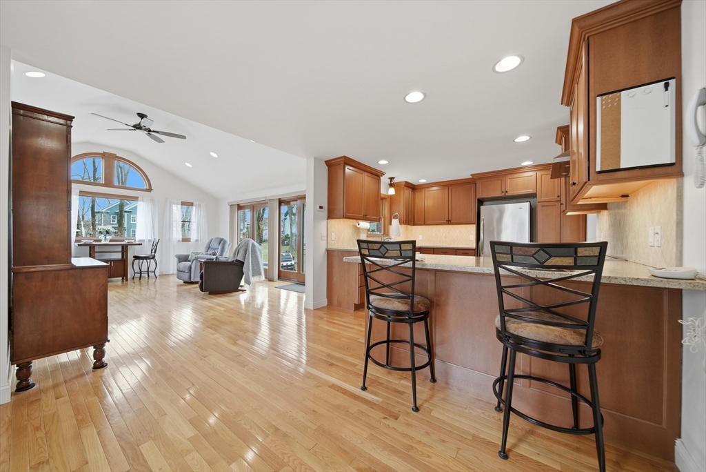 11 Lawrence Street Wakefield, MA 01880 - Photo 10 of 42 a living room with furniture and kitchen view
