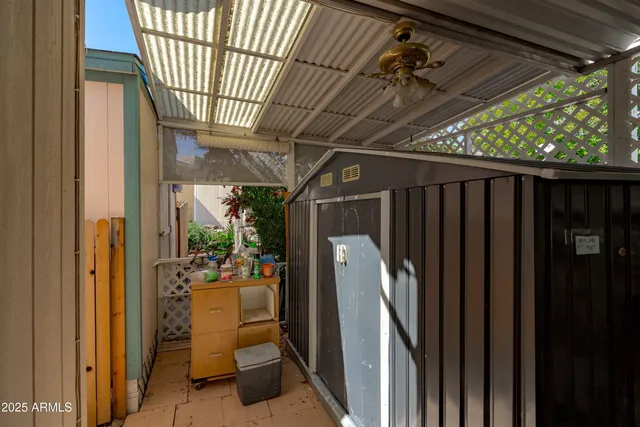 an aerial view of a city with lots of residential buildings and mountain view in back