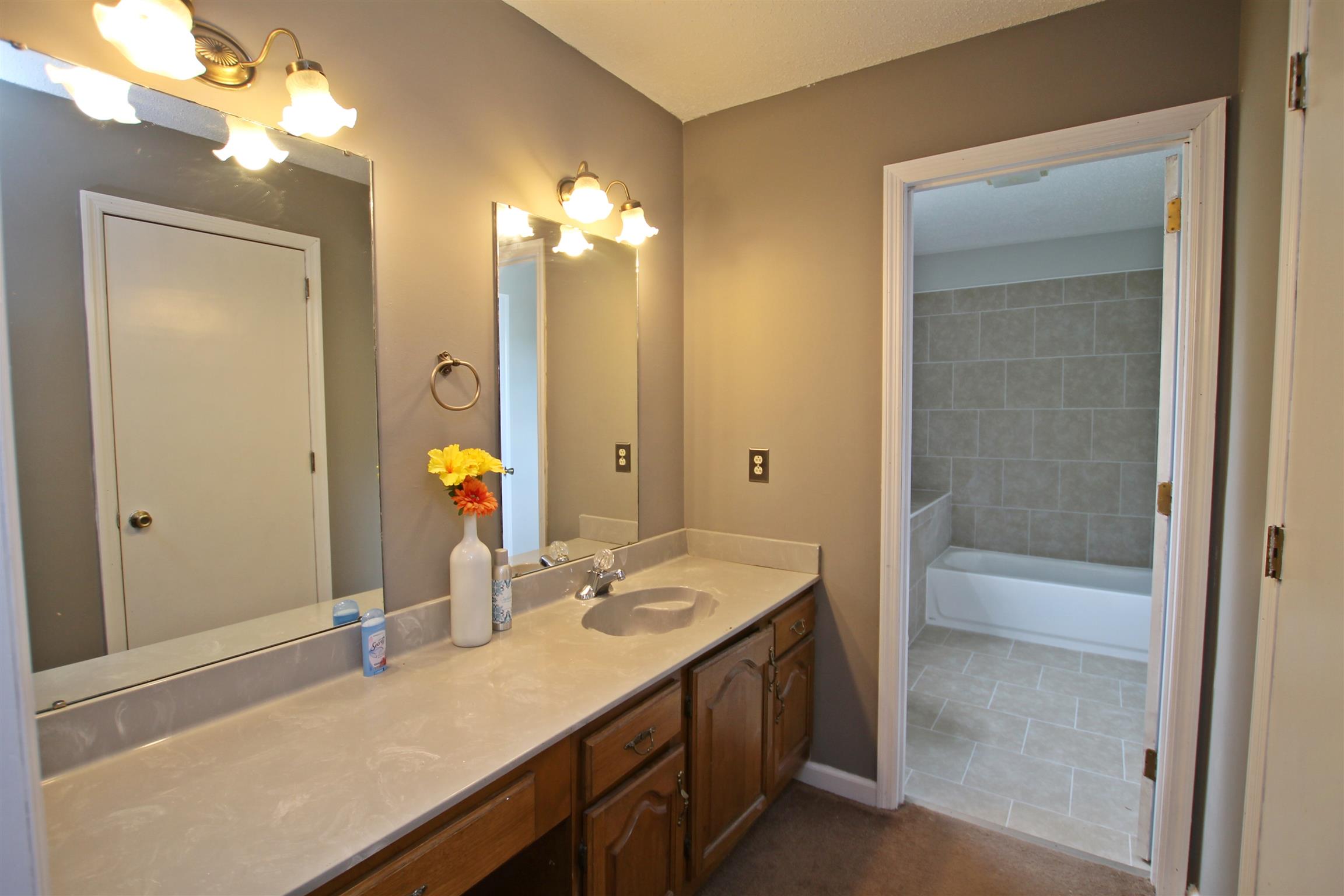 706 3rd Avenue West Springfield, TN 37172 - Photo 13 of 26 a bathroom with a sink double vanity and a mirror