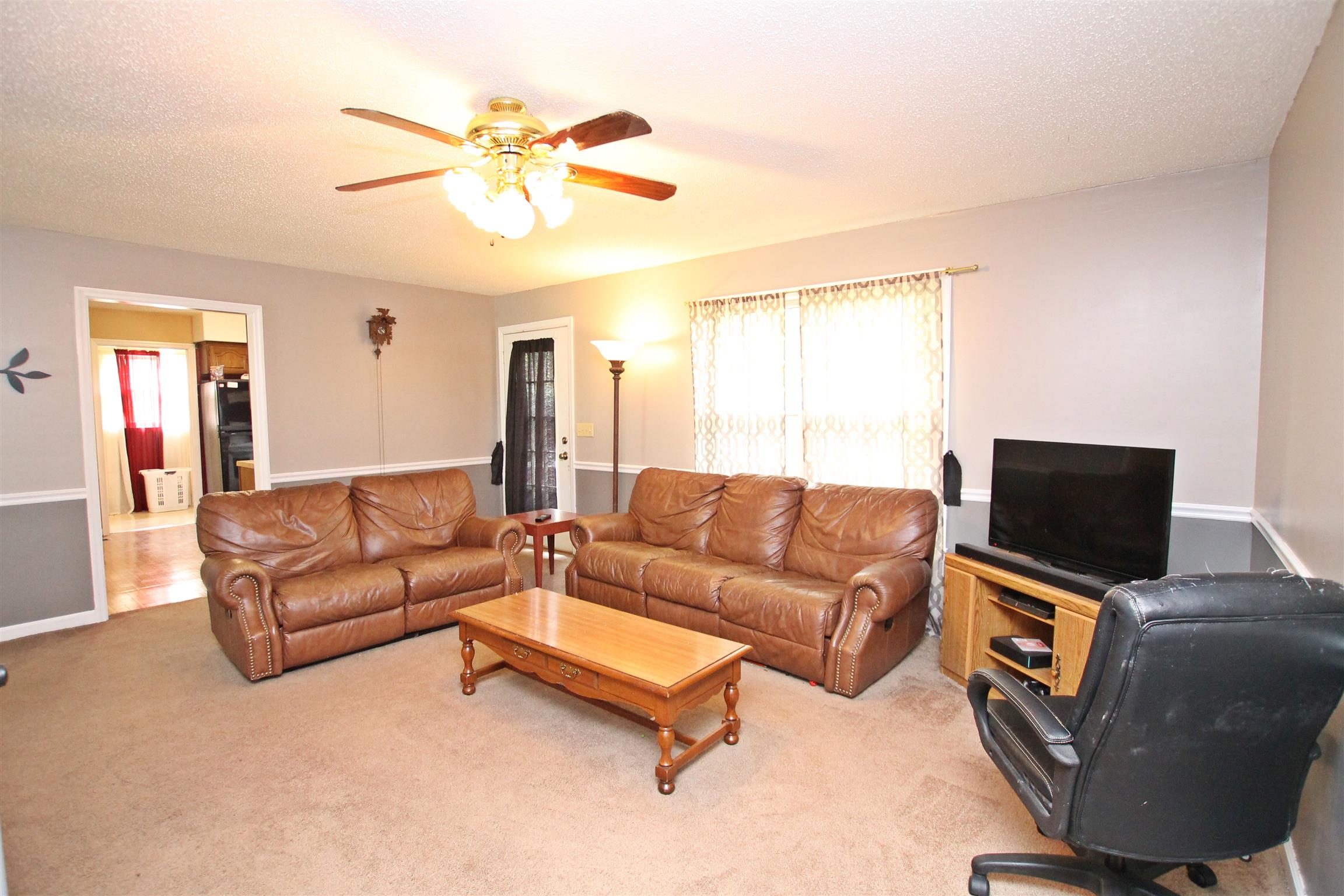 706 3rd Avenue West Springfield, TN 37172 - Photo 3 of 26 a living room with furniture and a flat screen tv