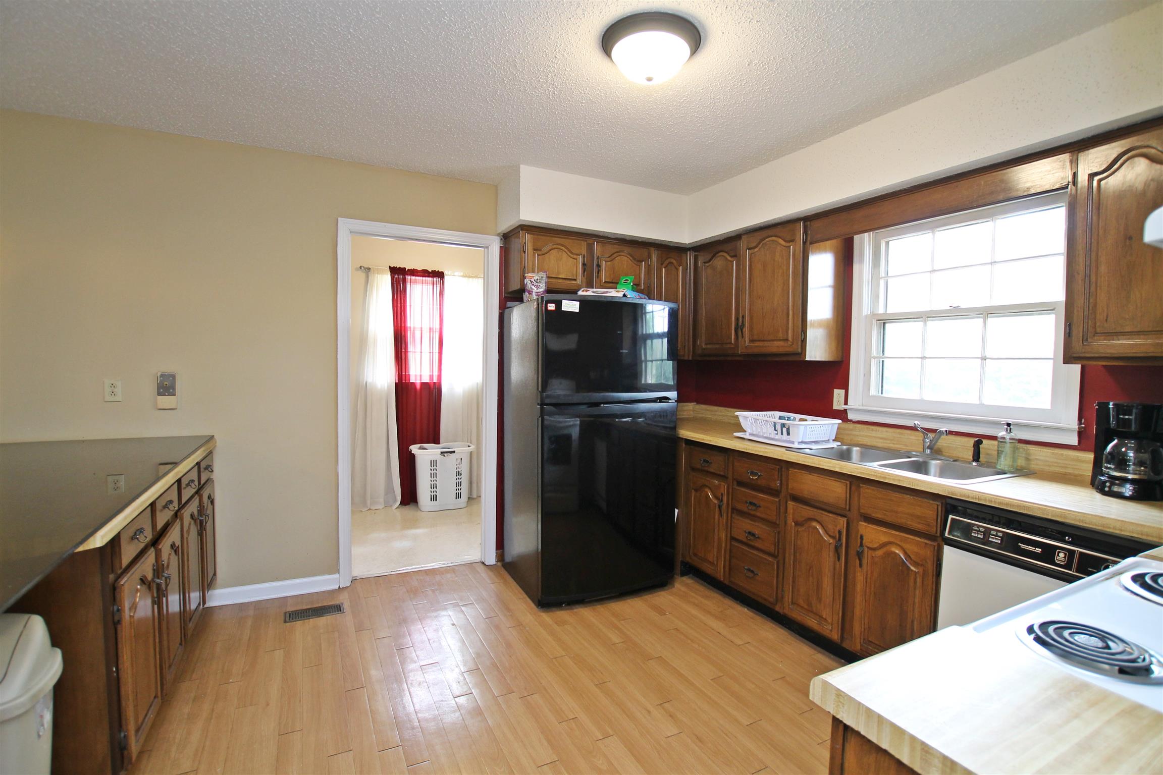 706 3rd Avenue West Springfield, TN 37172 - Photo 8 of 26 a kitchen with a refrigerator and a sink