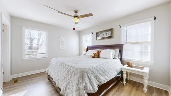 a bedroom with a large bed and a window