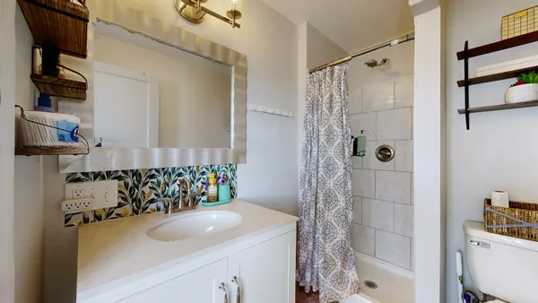 a bathroom with a sink and a shower