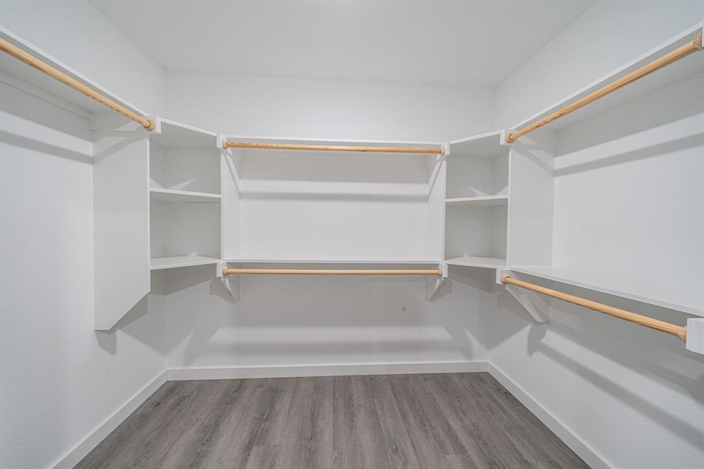 110 Red Oak Mabank, TX 75156 - Photo 15 of 30 a view of walk in closet with empty racks