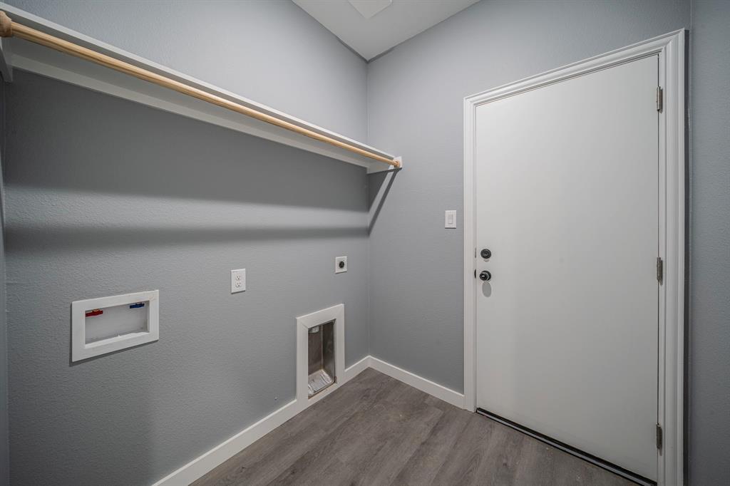 110 Red Oak Mabank, TX 75156 - Photo 21 of 30 a view of a hallway with wooden floor