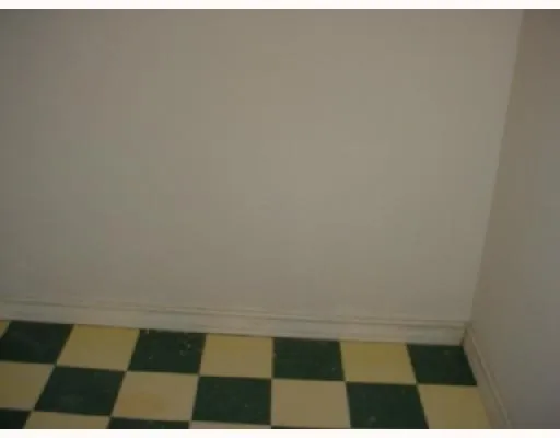 a view of a room that has a window in it