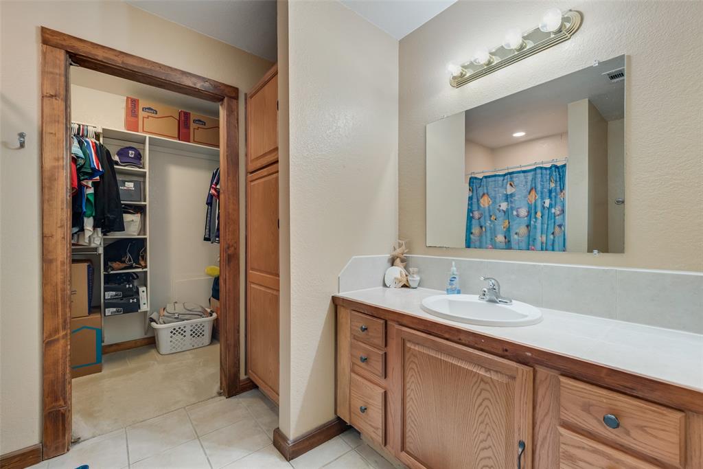 82 Trail Ridge Drive Melissa, TX 75454 - Photo 17 of 29 Secondary bath with large vanity and shower/tub combo with walk-in closet