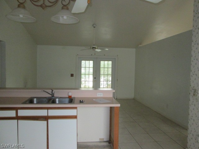 5615 Marina Road Bokeelia, FL 33922 - Photo 4 of 12 a view of a kitchen cabinets a sink and dishwasher