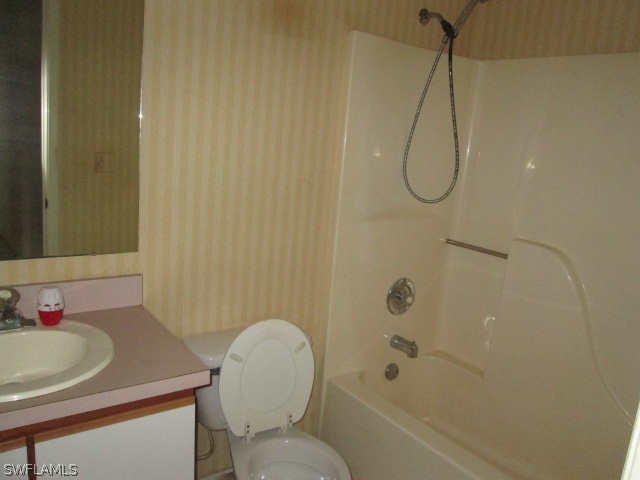 5615 Marina Road Bokeelia, FL 33922 - Photo 7 of 12 a bathroom with a sink a toilet and shower
