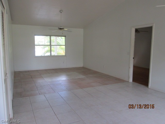 5615 Marina Road Bokeelia, FL 33922 - Photo 8 of 12 an empty room with windows and closet
