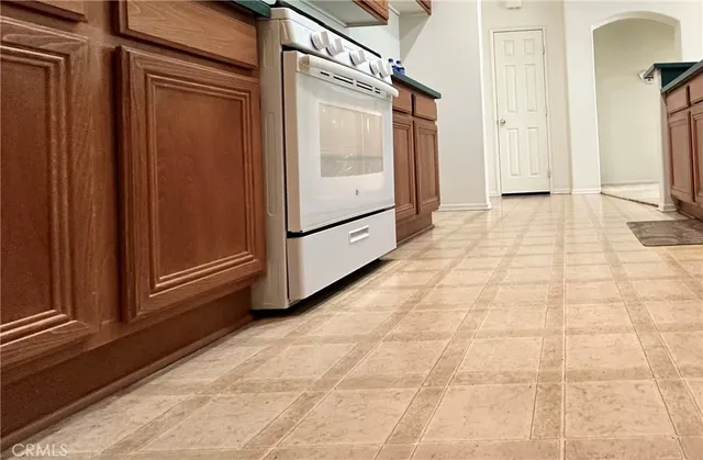 a view of a refrigerator with wooden floor