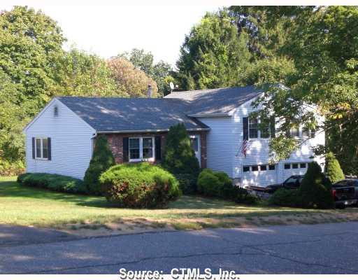 26 Pleasant View Road Thomaston, CT 06787 - Photo 1 of 1 a view of a house with a yard and potted plants