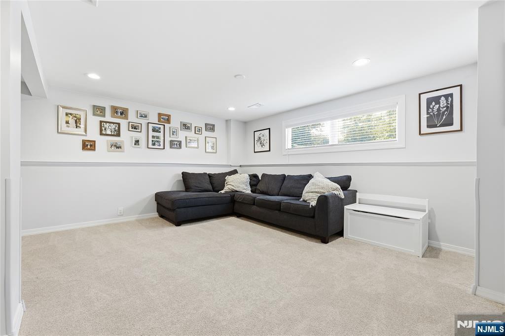 77 White Pond Road Waldwick, NJ 07463 - Photo 24 of 33 a living room with furniture and wall paintings