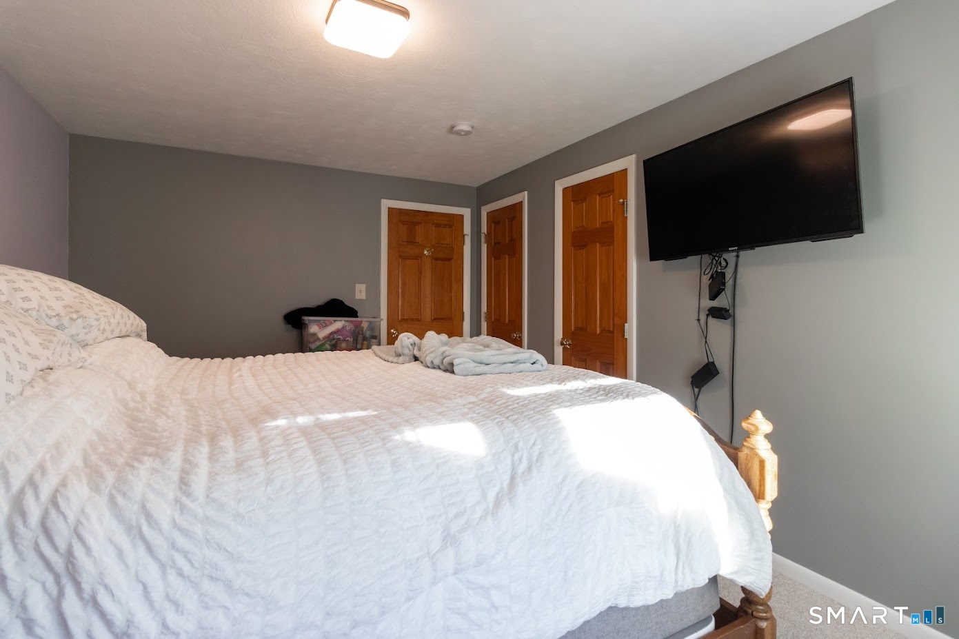 763 North Street Suffield, CT 06078 - Photo 31 of 40 a bedroom with a bed and a flat screen tv