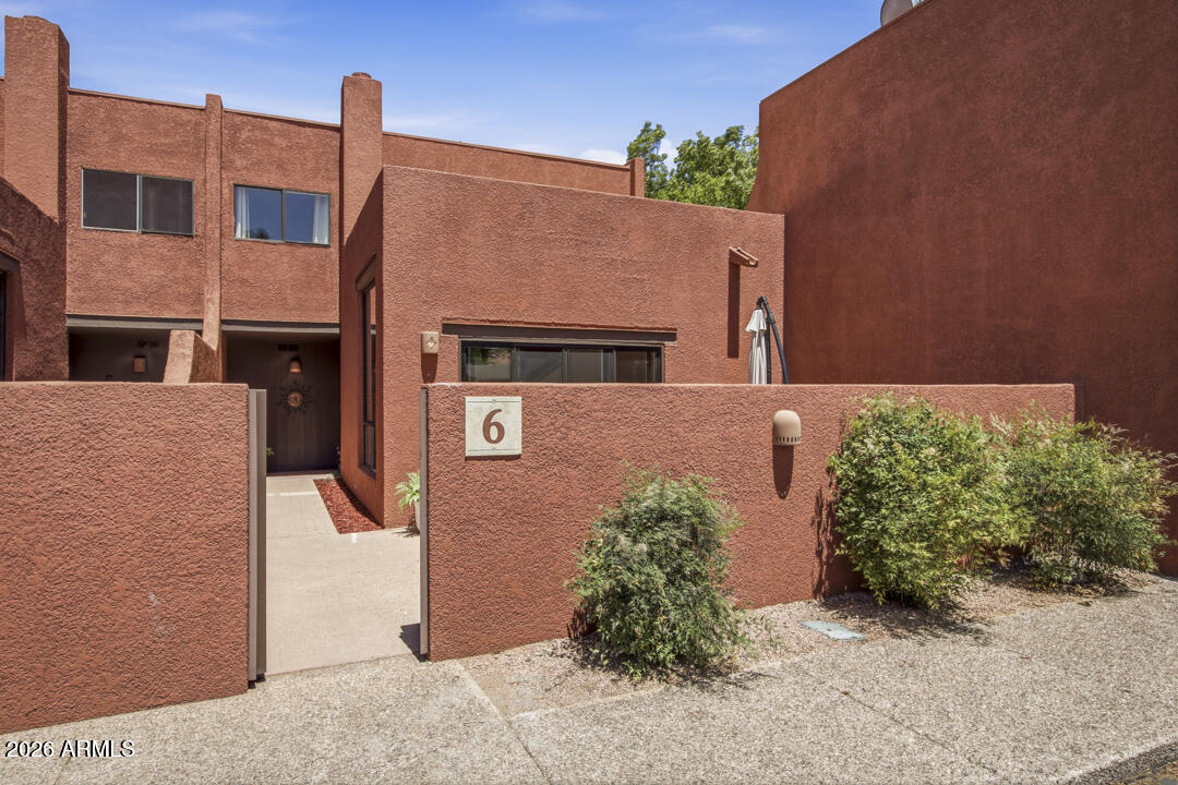 165 Verde Valley School Road, Unit 6 Sedona, AZ 86351 - Photo 39 of 40 a front view of a house with a yard