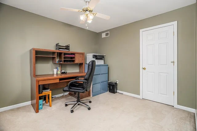 a view of a workspace with furniture