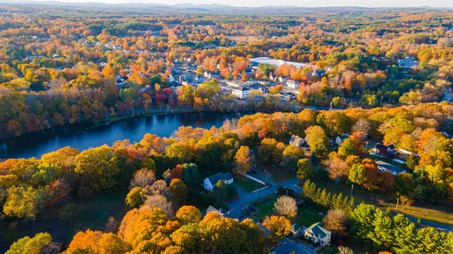 an aerial view of a house with a yard