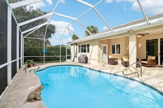a view of a swimming pool with a patio