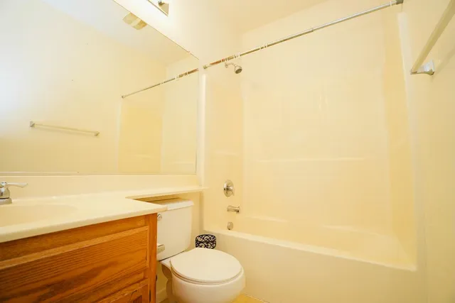 a bathroom with a toilet a sink and a bathtub