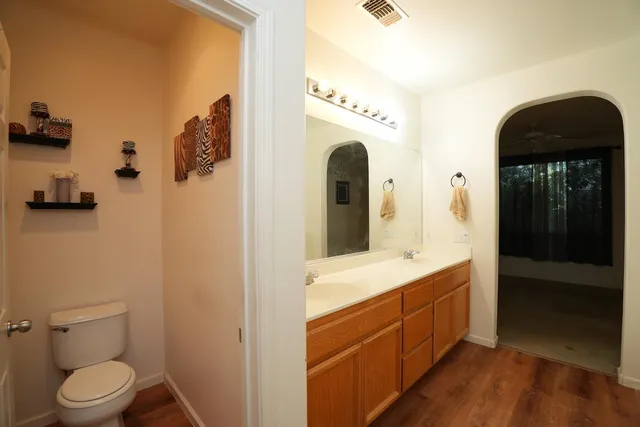 a spacious bathroom with a sink a toilet and shower