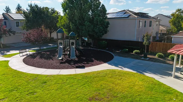 a view of a swimming pool with sitting area