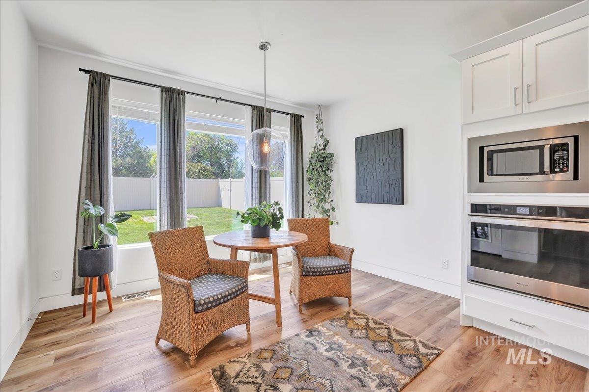 957 Birchton Loop Twin Falls, ID 83301 - Photo 12 of 32 Dining space featuring light wood finished floors and baseboards