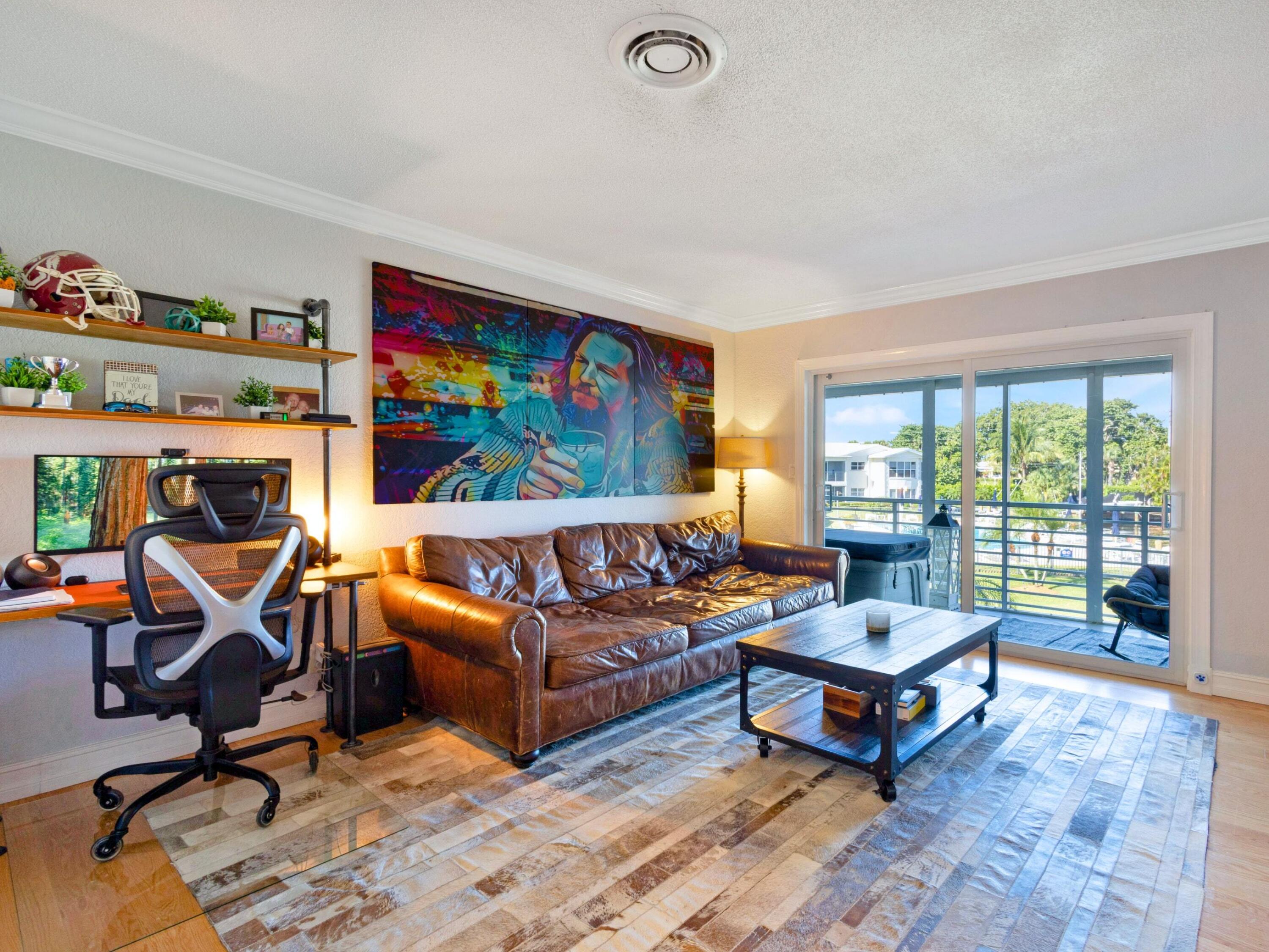 701 Harbour Drive, Unit 2140 Boca Raton, FL 33431 - Photo 11 of 35 a living room with furniture a rug and a large window