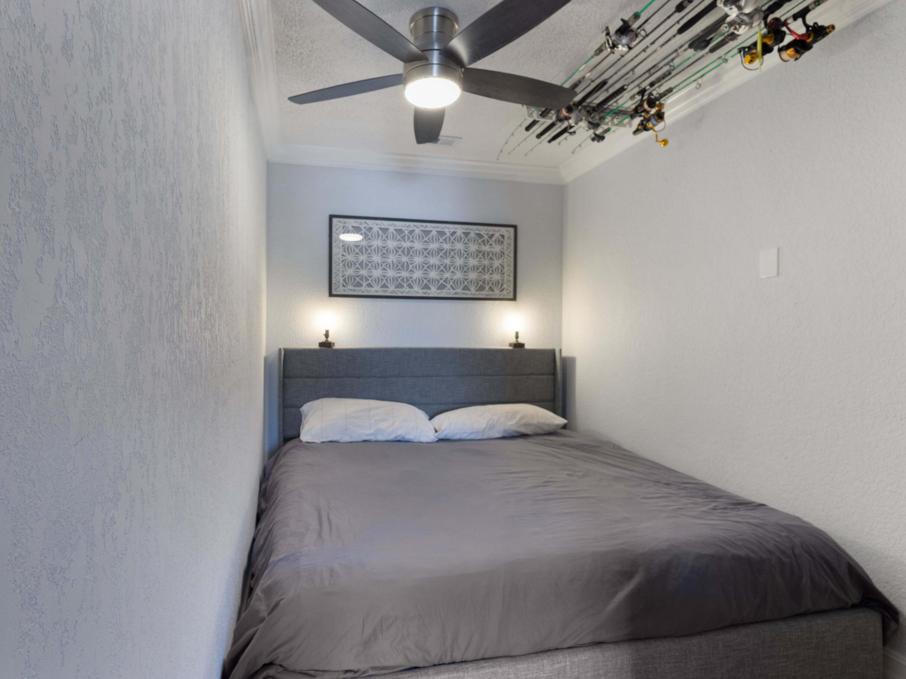 701 Harbour Drive, Unit 2140 Boca Raton, FL 33431 - Photo 14 of 35 a bedroom with a bed and a lamp on the wall