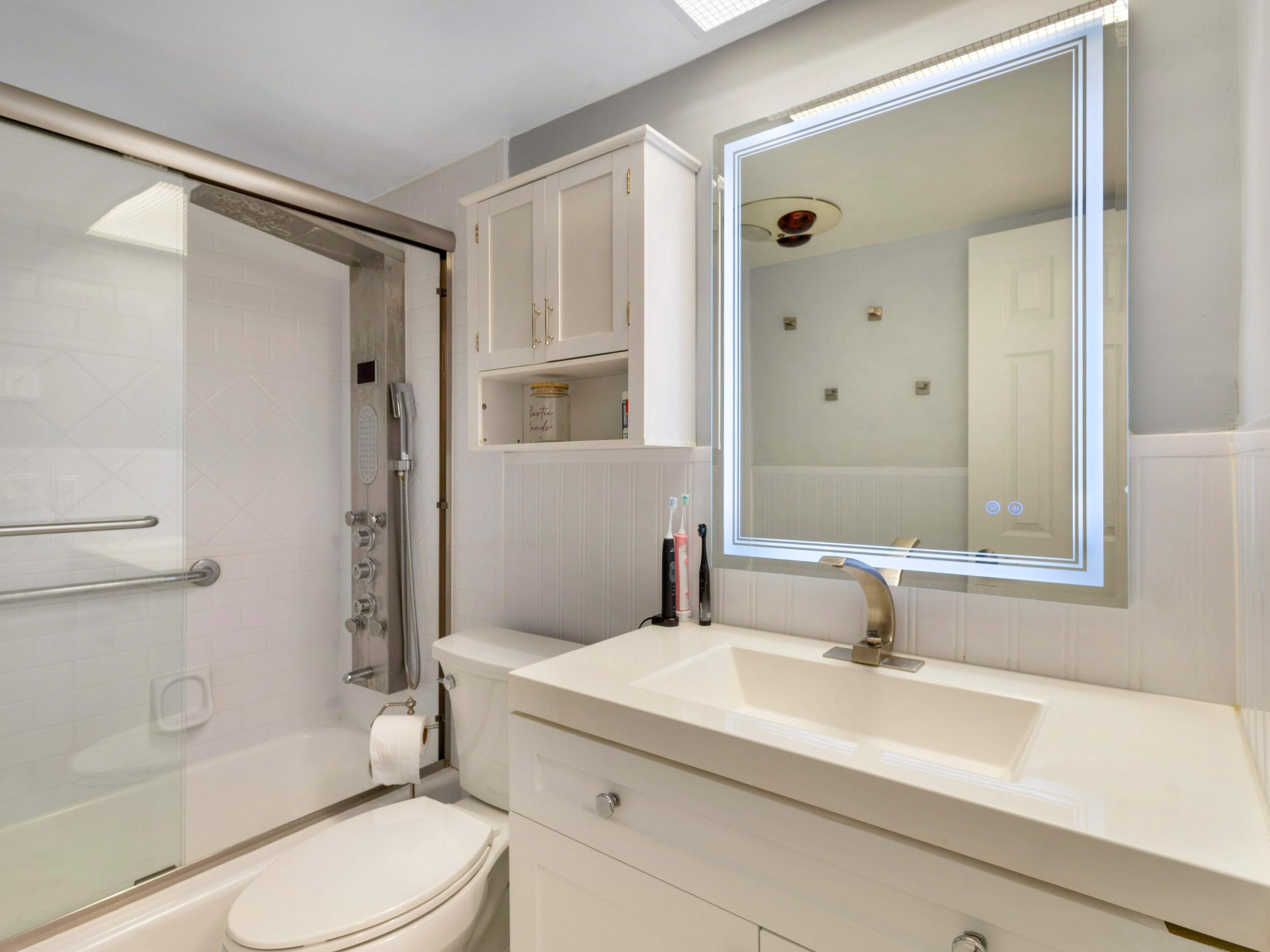 701 Harbour Drive, Unit 2140 Boca Raton, FL 33431 - Photo 15 of 35 a bathroom with a sink a toilet and shower