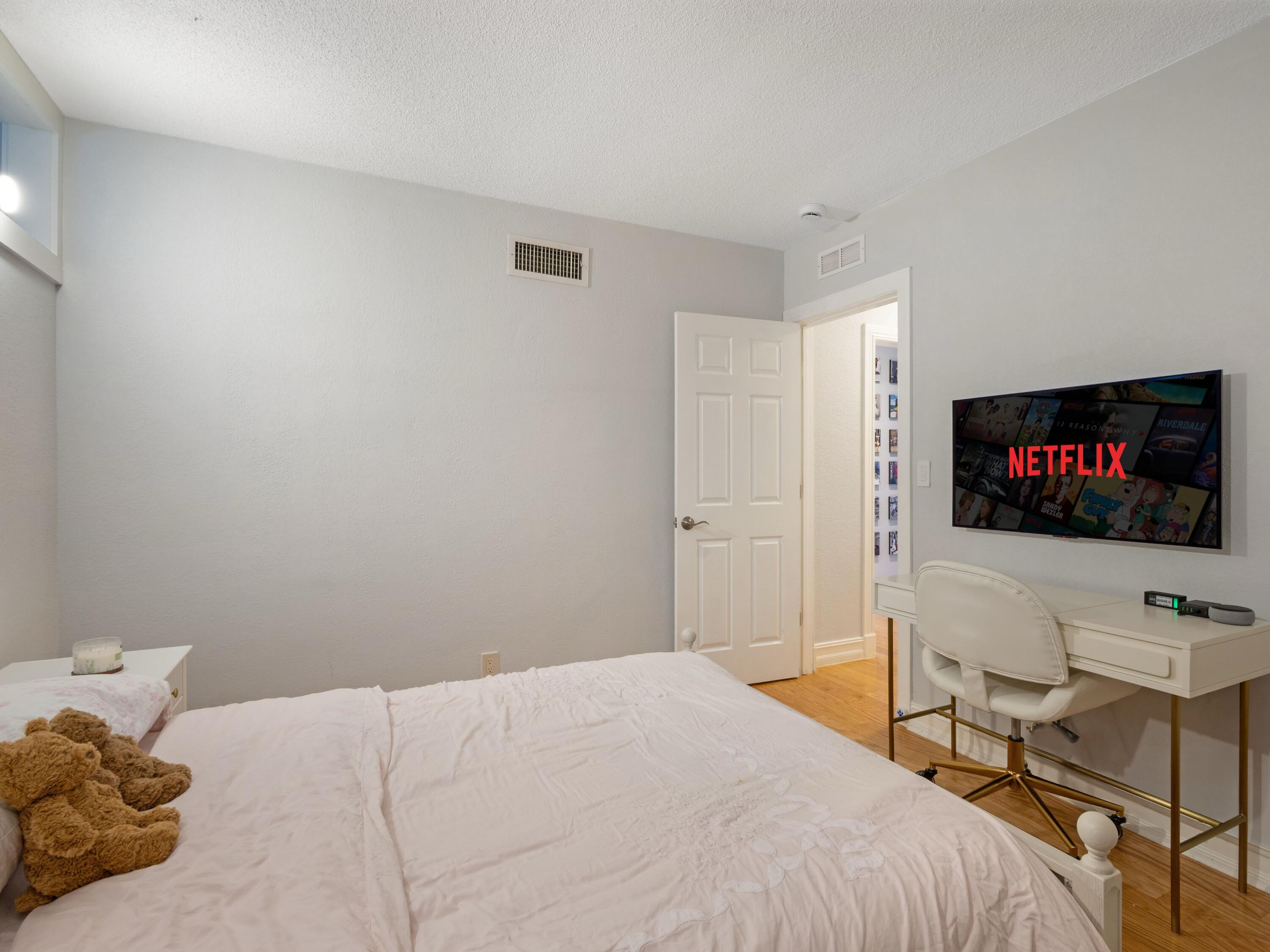 701 Harbour Drive, Unit 2140 Boca Raton, FL 33431 - Photo 17 of 35 a bedroom with a bed and a flat screen tv