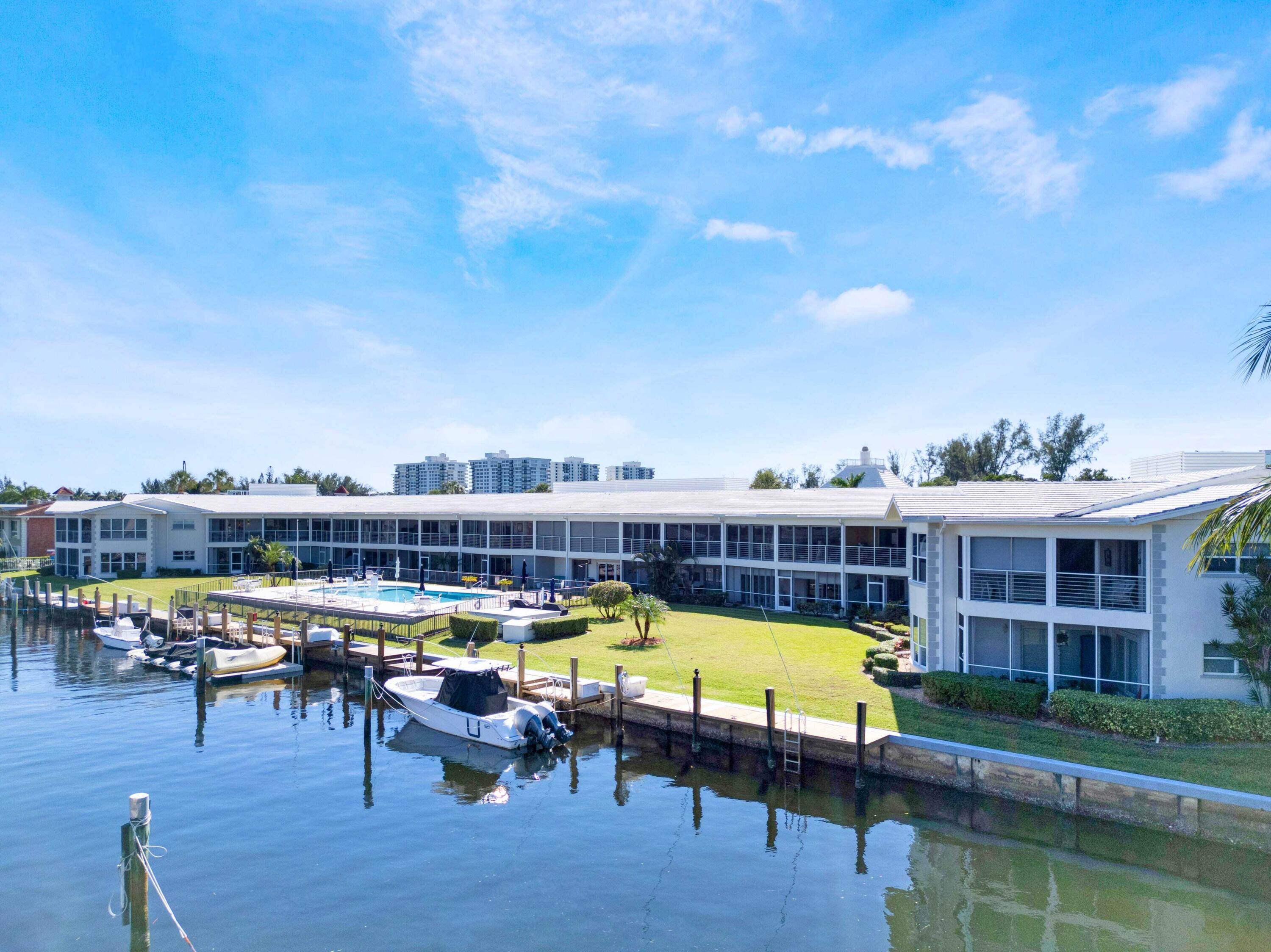 701 Harbour Drive, Unit 2140 Boca Raton, FL 33431 - Photo 2 of 35 a view of a swimming pool with a lounge chair